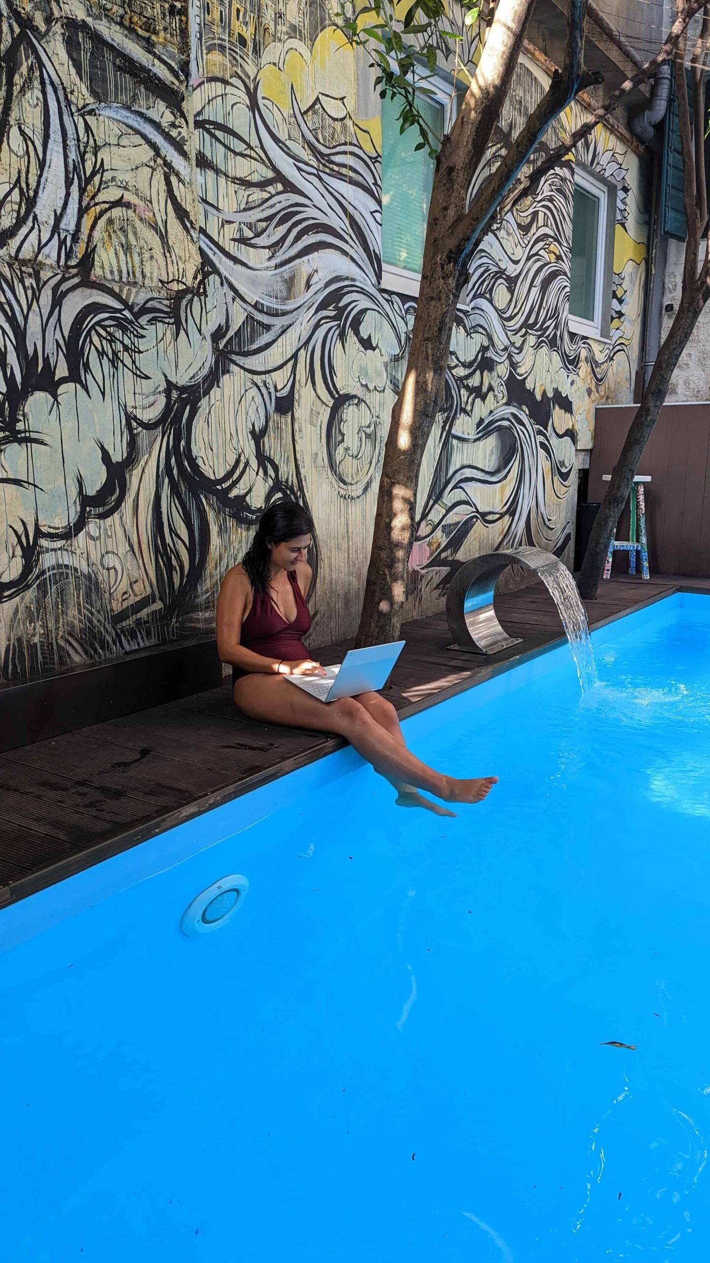 A woman with her online job by the pool