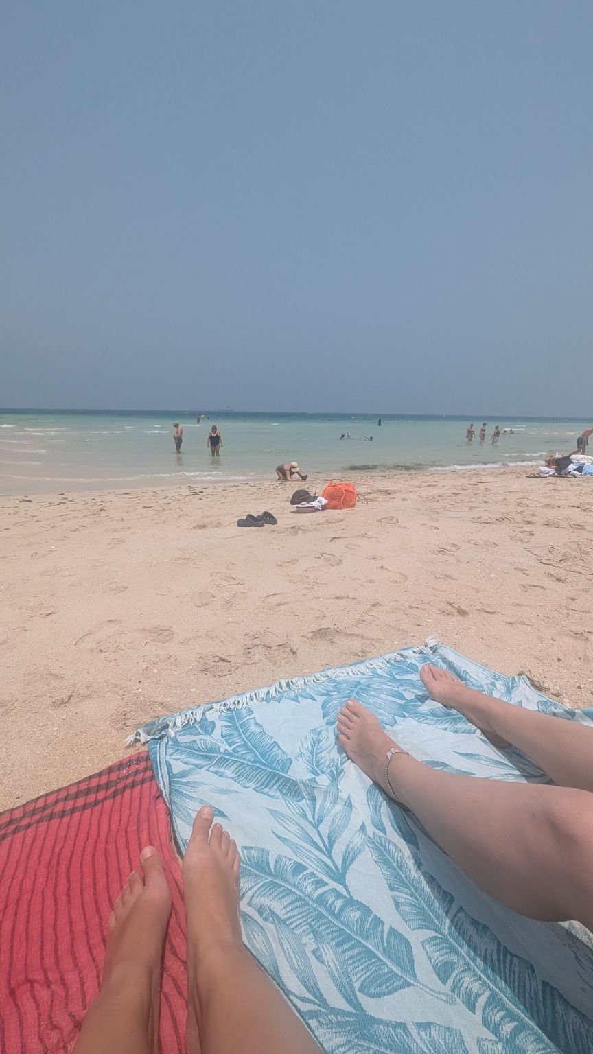 Best Time to Visit Dubai: A Month by Month Honest Guide (2026) Chilling by one of the less visited beaches with a friend