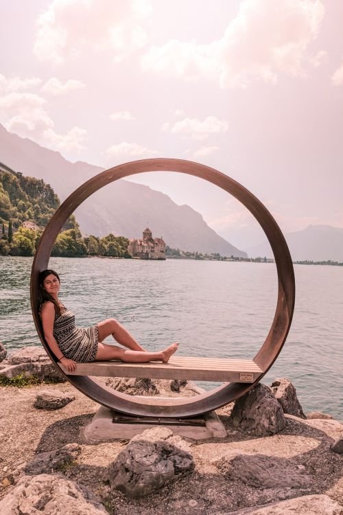 view of Chillon Castle in Switzerland through a circular monument
